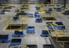 As robots take over warehousing, workers pushed to adapt