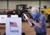 Wisconsin voters wait hours at the few open polling stations
