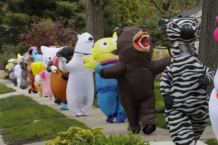 Virus Outbreak Michigan T-Rex Walking Club