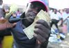 Zimbabweans mend shabby dollar notes amid economic crisis