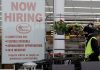 Gripped by surging pandemic, U.S. employers cut back on hiring