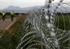 Split Cyprus defends razor wire to halt migrant crossovers