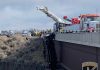 Rescuers save 2 from pickup dangling over deep Idaho gorge