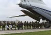 Russia orders troop pullback but keeps weapons near Ukraine