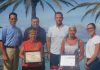 The Aruba Tourism Authority honor loyal visitors on the island; Mr. Joakim & Mrs. Karin Waldemark & Mr. John & Mrs. Karen Mostacci