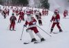 It’s all downhill for 300 skiing Santas, a Grinch and a tree