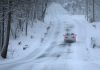 Winter storms dump snow on both US coasts as icy roads make for hazardous travel