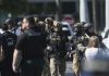 A SWAT team sniper killed a bank hostage-taker armed with a knife, sheriff says
