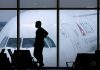 A passenger waits for a Delta Airlines flight at Hartsfield-Jackson International Airport in Atlanta on Feb. 18, 2021.