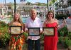 The Aruba Tourism Authority honor loyal visitors on the island! Christina, Alexandra and Gilbert Whesper