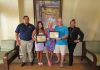 Aruba Tourism Authority honored loyal visitors at Marriott Aruba Surf Club! Mr. Todd & Mrs. Kimberly Benson and Ms. Kendall Benson