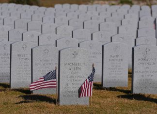 The government shutdown prompts the cancellation of some Veterans Day events