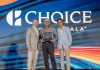 Radisson Blu Aruba’s Luigi Wix Named Choice Hotels’ General Manager of the Year A group of men standing on stage with a large sign Description automatically generated