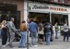 In New York, waiting in line becomes a social scene