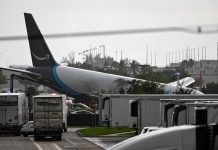 Amazon cargo plane overshoots Miami runway, hits vehicles, catches fire
